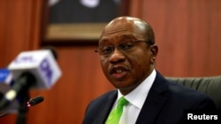 FILE—Nigeria's Central Bank Governor Godwin Emefiele briefis the media during the MPC meeting in Abuja