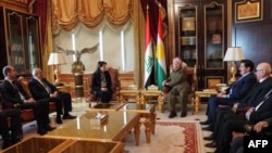 A handout picture provided by the office of the Kurdistan Democratic Party leader on Feb. 16, 2025, shows KDP chief Masoud Barzani (center-right) meeting with co-leader of the People's Democratic Party Pervin Buldan (center-left), joined by other delegation members in Irbil. 