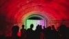 FILE - Rave attendees dance in an abandoned air raid shelter in Guangzhou, China, on Aug. 20, 2023. 