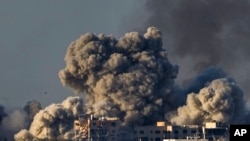 FILE - Smoke rises following an Israeli bombardment in the Gaza Strip, as seen on December 16, 2023. More Americans think foreign policy should be a top focus of elections in 2024 amid ongoing wars in the Gaza Strip and Ukraine..