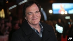 Director Quentin Tarantino poses for photographers upon arrival at the premiere of the film 'The Hateful Eight' in London, Dec. 10, 2015.