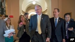 The leaders of the House Intelligence Committee, Rep. Mike Conaway, R-Texas (C), and Rep. Adam Schiff, D-Calif. (R), speak with reporters as they emerge from a closed-door meeting at the Capitol with Sheryl Sandberg, chief operating officer of social media giant Facebook.