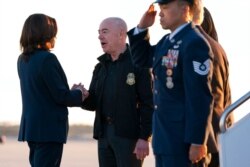 Vice President Kamala Harris greets Homeland Security Secretary Alejandro Mayorkas as she arrives to board Air Force Two, at Andrews Air Force Base, Md., en route to El Paso, Texas, June 25, 2021.