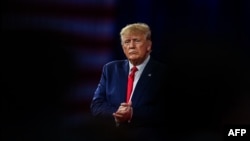 FILE - Former U.S. President Donald Trump is seen at an event in Orlando, Florida, Feb. 26, 2022. U.S. District Judge Tanya Chutkan on Aug. 28, 2023, set his high-profile election interference trial for March 4, 2024, rejecting dates proposed by prosecutors and defense lawyers.