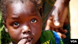 Omema survived lead poisoning but her caretakers say she can't hear or speak and is constantly sickly. Parents say they can't count the number of children that have been killed by lead poisoning in recent years. (H. Murdock for VOA)