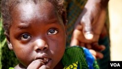 Omema survived lead poisoning but her caretakers say she can't hear or speak and is constantly sickly. Parents say they can't count the number of children that have been killed by lead poisoning in recent years. (H. Murdock for VOA)