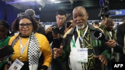 African National Congress Deputy Secretary-General Nomvula Mokonyane, left, arrives with ANC Chairperson Gwede Mantashe at the Independent Electoral Commission National Results Center in Midrand, South Africa, on June 1, 2024. The ANC lost is parliamentary majority.