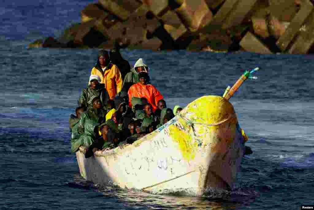 A fiberglass boat with migrants arrives at the port of La Restinga on the island of El Hierro, Spain.