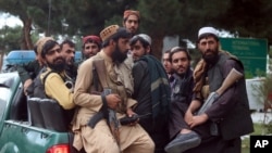 Taliban fighters arrive inside the Hamid Karzai International Airport after the U.S. military's withdrawal, in Kabul, Afghanistan, Aug. 31, 2021.