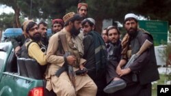 Taliban fighters arrive inside the Hamid Karzai International Airport after the U.S. military's withdrawal, in Kabul, Afghanistan, Aug. 31, 2021.