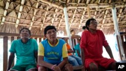 FILE - Indigenous elders attend a hearing on the Waimiri-Atroari reserve in Brazil's Amazon state, Feb. 27, 2019.