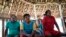 FILE - Indigenous elders attend a hearing on the Waimiri-Atroari reserve in Brazil's Amazon state, Feb. 27, 2019.