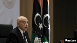 FILE - Aguila Saleh, Libya's parliament president, speaks during the first session at parliament headquarters in Benghazi, Libya, April 13, 2019. 