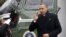 U.S. President Barack Obama (R) salutes as he returns via Marine One from a Christmas visit with his family in Hawaii, to the White House in Washington, December 27, 2012. REUTERS/Jonathan Ernst  (UNITED STATES - Tags: POLITICS)
