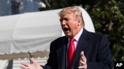 President Donald Trump speaks to reporters upon arrival at the White House in Washington, Sunday, Nov. 3, 2019. (AP Photo/Manuel Balce Ceneta)