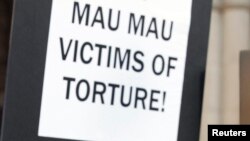 Wambugu Nyingi stands outside the High Court in London, Britain, April 7, 2011. 