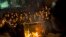 Ultra-orthodox Jews push a burning garbage bin towards Israeli security forces during a protest against military conscription of yeshiva students, in Jerusalem, May 16, 2013. 
