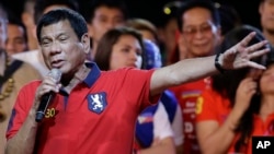 Philippine presidential race front-runner Davao city mayor Rodrigo Duterte gestures during his final campaign rally in Manila, Philippines, May 7, 2016. 