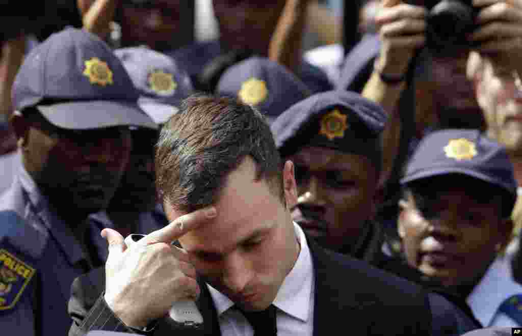 Oscar Pistorius leaves the high court in Pretoria, South Africa, Oct. 13, 2014. 