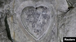 Inscriptions by WWI soldier J.G. Gibb, 2nd Highland Light Infantry, are seen on the rock in underground caves accessible by small spiral stairs in the village's church at Bouzincourt, northern France, July 13, 2015.