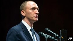 FILE - In this July 8, 2016, photo, Carter Page, then adviser to U.S. Republican presidential candidate Donald Trump, speaks at the graduation ceremony for the New Economic School in Moscow, Russia.