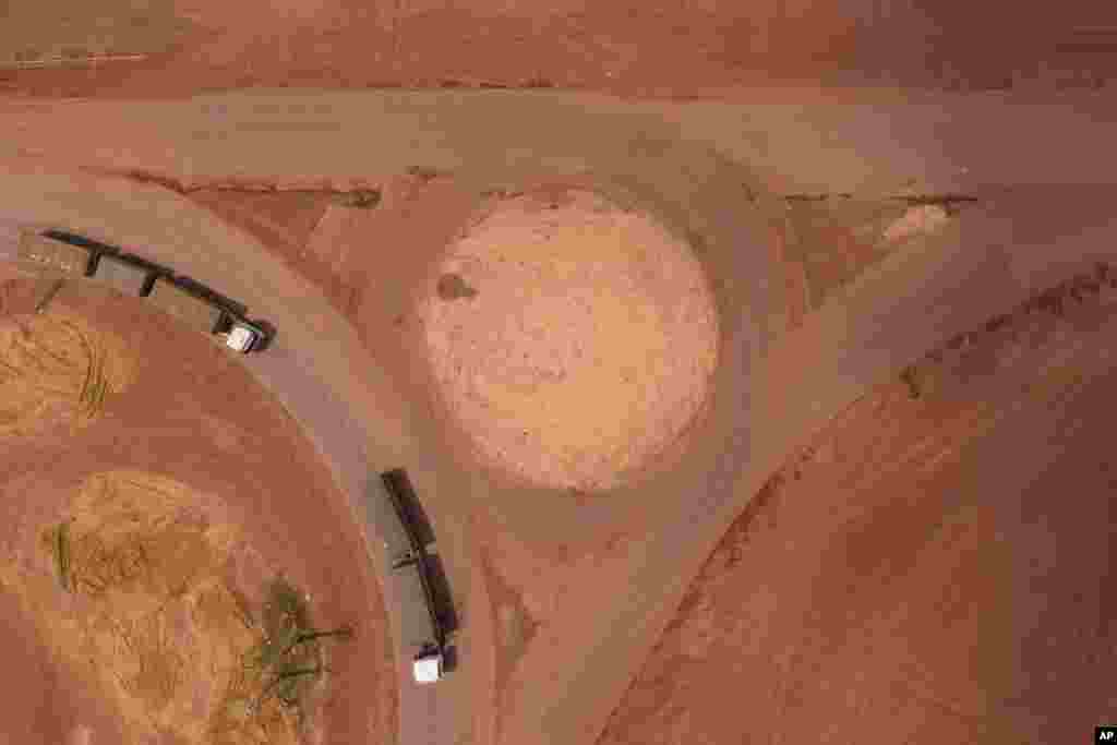 Cargo trucks turn off the Trans-Amazon highway onto route BR-163 in Campo Verde, near Itaituba, Para state, Brazil.