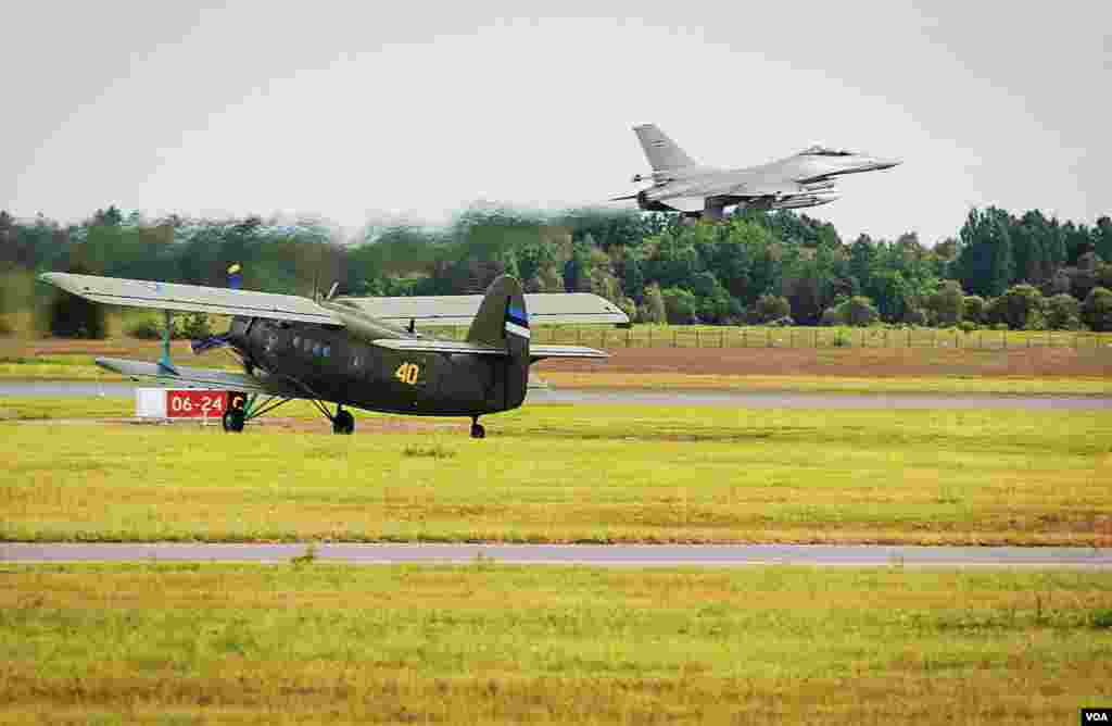 At Estonia’s Amari Airbase, a Danish F-16 fighter jet takes off from a newly renovated NATO standard base. Waiting to take off is a Soviet era AN-2 biplane, one of two fixed wing aircraft in Estonia’s fledgling air force. (Vera Undritz/VOA)