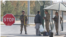 Uzbek border security officers inspecting an Afghan citizen at Termez-Hairatan crossing, Uzbekistan, Nov. 3, 2021 (VOA)