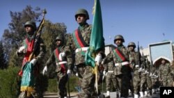 Afghan soldiers march during the second phase of transfer of authority ceremony from the NATO-led troops to Afghan security forces in Jalalabad, Nangarhar province, east of Kabul, Afghanistan, January 26, 2012.