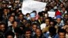 African migrants hold placards during a protest opposite the Knesset, the Israeli parliament, in Jerusalem, Jan. 8, 2014. 