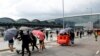 Protesters build barricades outside the terminals at Hong Kong International Airport, in Hong Kong, Sept. 1, 2019. 