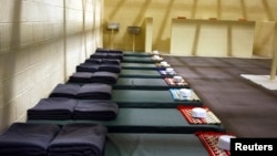 FILE - A cell block at detention center is seen at the U.S. Bagram Airfield, north of Kabul.