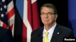 FILE - U.S. Secretary of Defense Ash Carter listens during a news conference in Tallinn, Estonia, June 23, 2015.