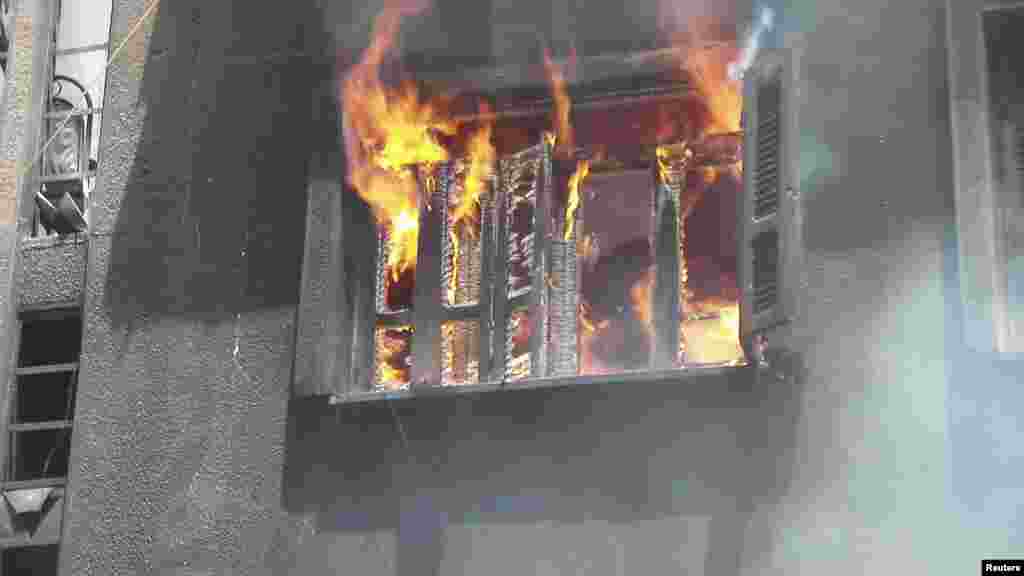 Fire burns after shelling at the Al Qussoor area in Homs, Syria, June 18, 2012.