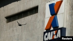 FILE - A view shows the company logo of Caixa Economica Federal bank in downtown Rio de Janeiro, Brazil.