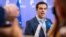Greek Prime Minister Alexis Tsipras speaks with the media after a meeting of eurozone heads of state at the EU Council building in Brussels, July 13, 2015. 