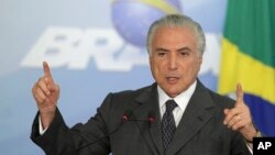 FILE - President Michel Temer speaks during a ceremony at the Planalto Presidential Palace, in Brasilia, Brazil, Dec. 13, 2016. 