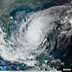 This satellite image provided by NOAA shows the center of Milton moving East at 10 mph with maximum sustained winds of about 180 mph, Oct. 7, 2024.