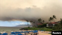 Smoke blankets the sky as a wildfire spreads in Maui, Hawaii, in this July 11, 2019, photo obtained from social media. 