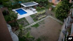 Grass sits dry due to the lack of water, at a wealthy apartment complex in Caracas, Venezuela, June 11, 2018.