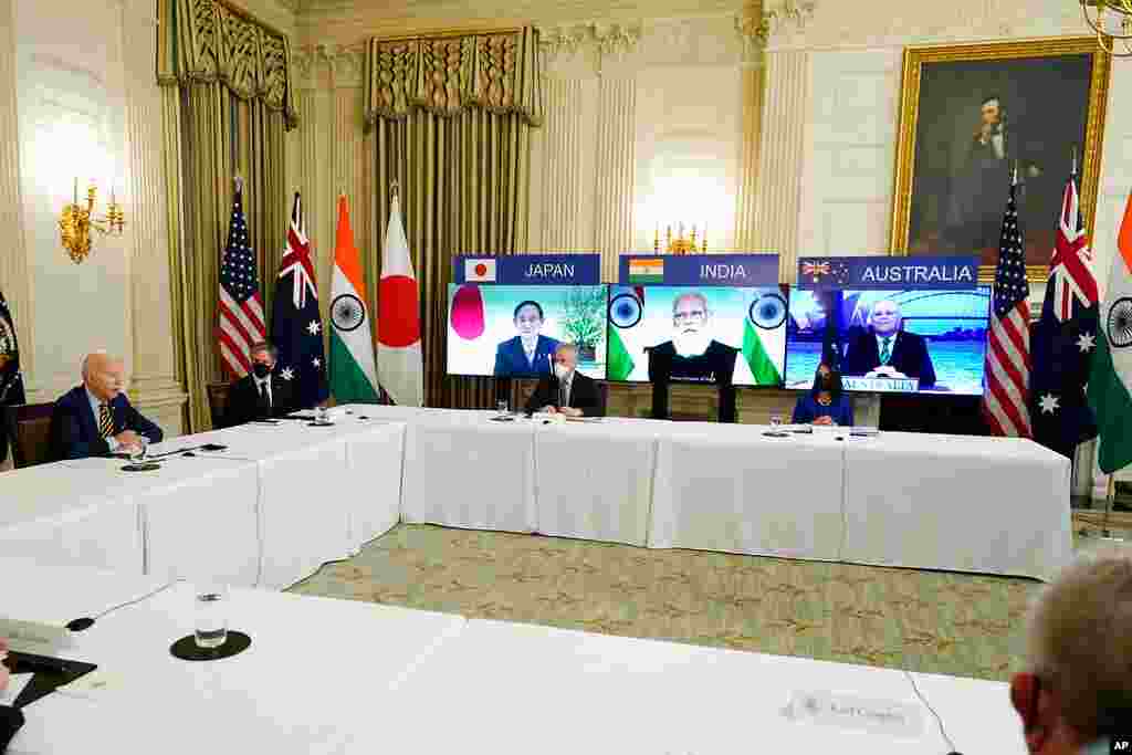 President Joe Biden speaks during a virtual meeting with Indian Prime Minister Narendra Modi, Australian Prime Minister Scott Morrison and Japanese Prime Minister Yoshihide Suga, from the State Dining Room of the White House.