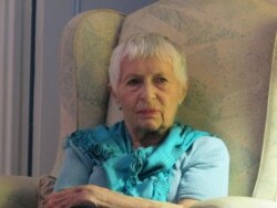 FILE - Jane Hughes Gignoux leads a Death Cafe discussion at her home in New York City, Oct. 8, 2013.