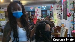 Kemi Lawani, who owns Bonitas Extensions and Braids, reopened her salon for hair styling last week, in Minneapolis, Minnesota. The salon had been closed for months due to the coronavirus pandemic and George Floyd protests. (Photo courtesy of Kemi Lawani)