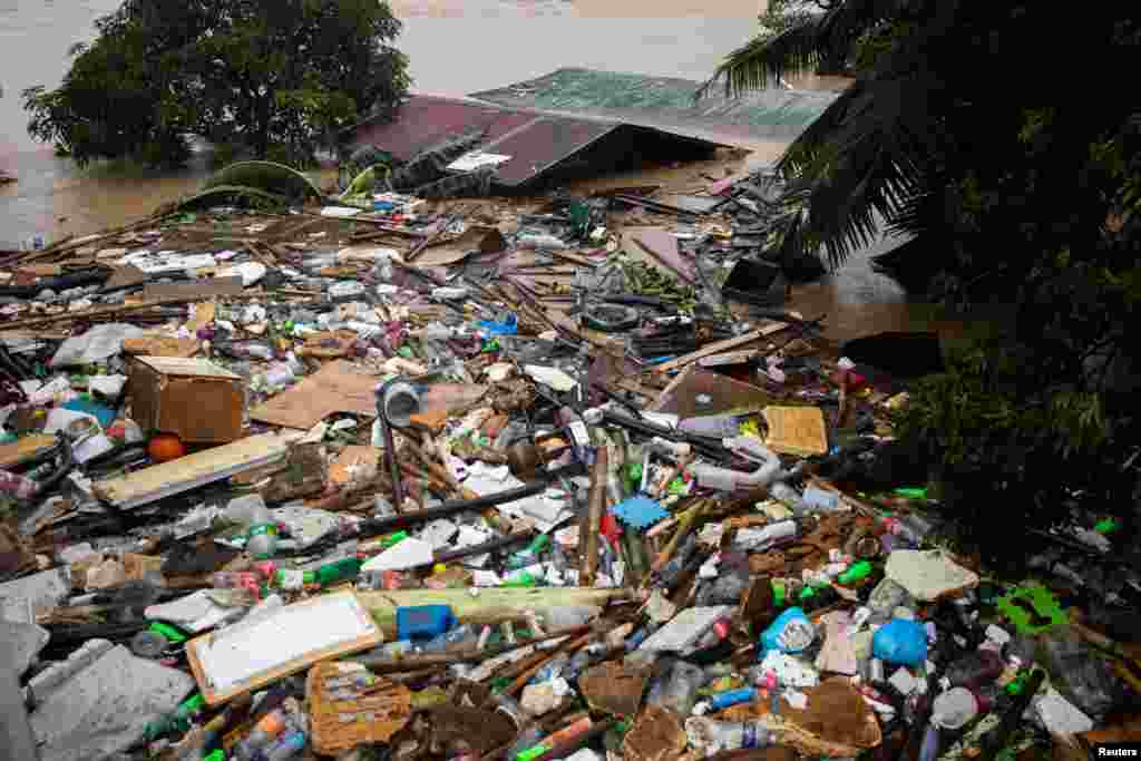 A roof is shown submerged in floodwaters following Typhoon Vamco, in San Mateo, Rizal province, Philippines.