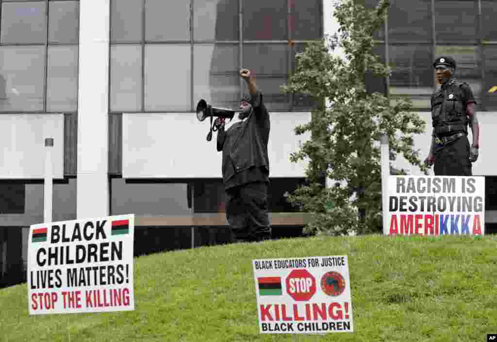 People participate in a rally against racism, injustice and white supremacy, in Perk Park, before the Republican National Convention in Cleveland, Ohio, July 16, 2016.