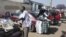 FILE - Hawkers sell goods on the streets of Harare, Sept. 17, 2015.