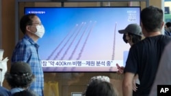 A TV screen shows a file image of North Korea's missiles launch during a news program at Seoul Railway Station in Seoul, South Korea, Sept. 18, 2024.