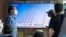 A TV screen shows a file image of North Korea's missiles launch during a news program at Seoul Railway Station in Seoul, South Korea, Sept. 18, 2024.
