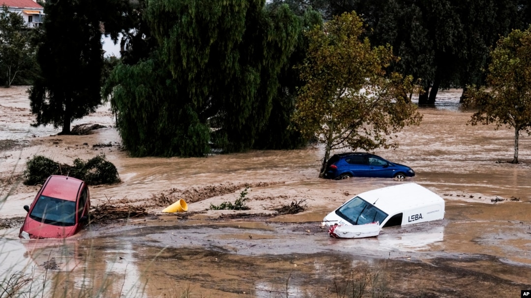 Cars are being swept away by the water, after floods preceded by heavy rains caused the river to overflow its banks in the town of Alora, Malaga, Spain, Oct. 29, 2024. 