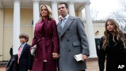 FILE - Donald Trump Jr., wife Vanessa Trump, and their children Donald Trump III, left, and Kai Trump, right, leave St. John's Episcopal Church across from the White House in Washington, Jan. 20, 2017. 